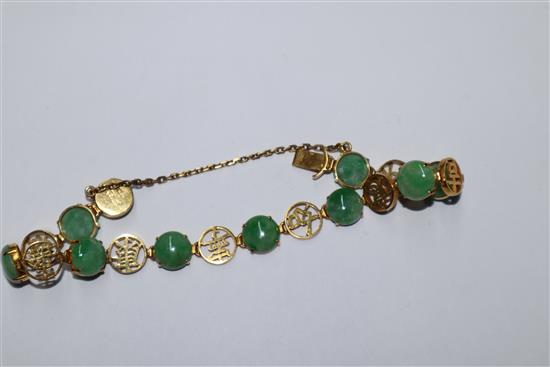 A Chinese 14k yellow metal, character link and cabochon jadeite set bracelet, gross 12.4 grams.